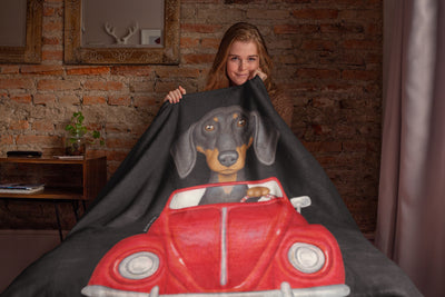 Cute Doxie Dog driving red car on Dachshund Throw Blanket